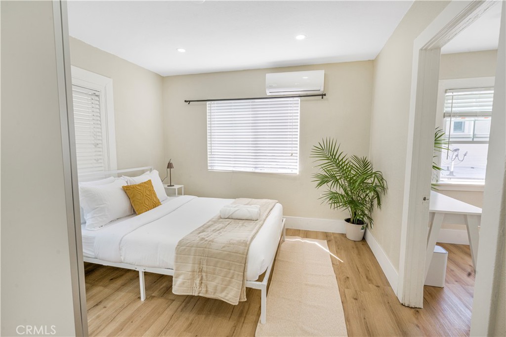 316 La France Avenue, Unit B Alhambra, CA 91801 - Photo 4 of 20 a bedroom with a bed and wooden floor