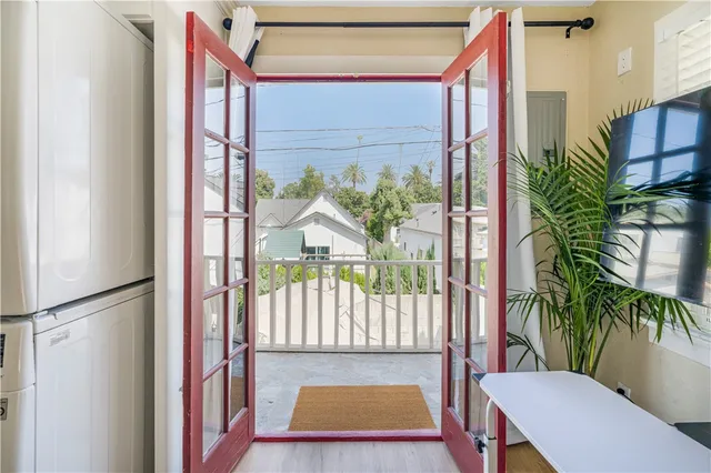 a view of a balcony with furniture