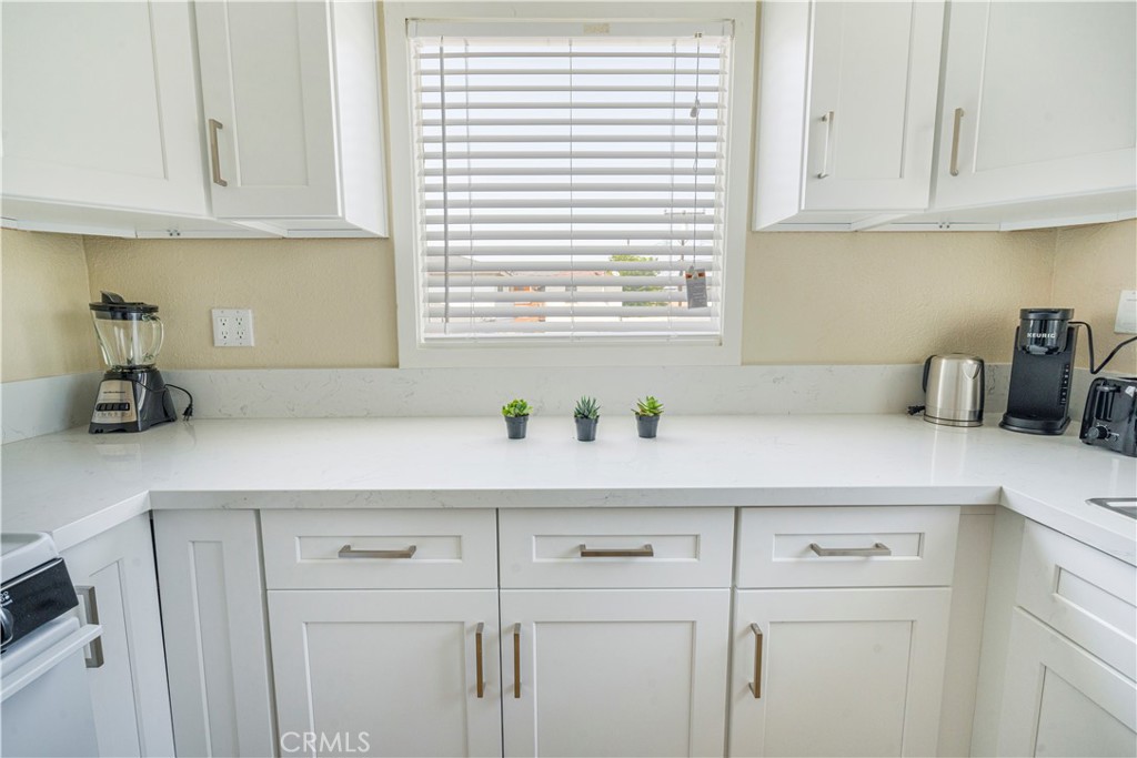 316 La France Avenue, Unit B Alhambra, CA 91801 - Photo 9 of 20 a kitchen with cabinets and window