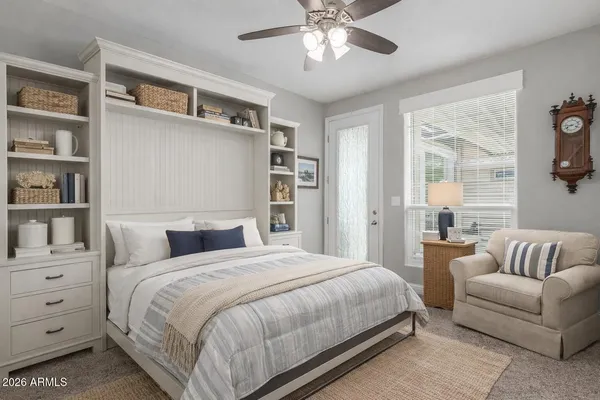 a bedroom with a large bed and a couch