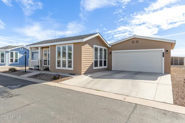 a front view of a house with a garage