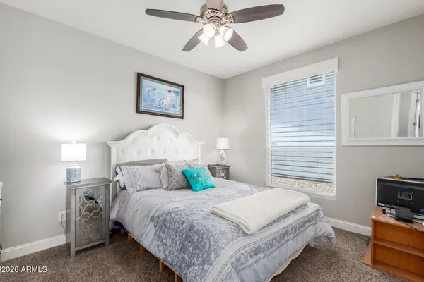a bedroom with a bed and a tv