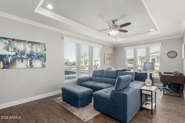 a living room with furniture and a large window
