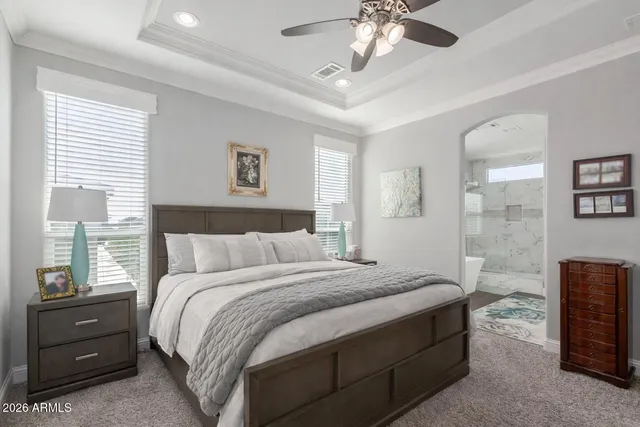 a bath tub sitting in a bathroom next to a window