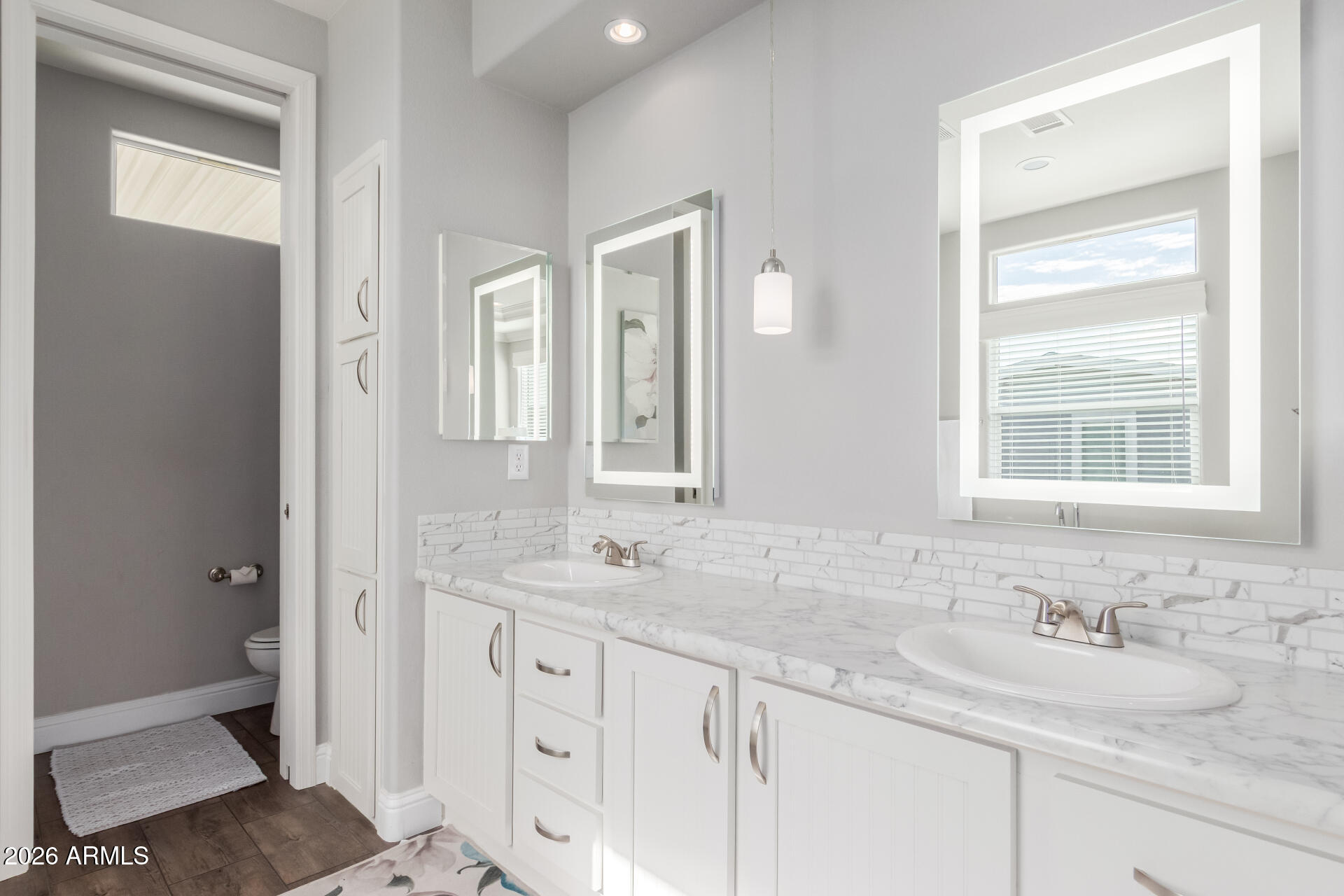 3301 South Goldfield Road, Unit 6031 Apache Junction, AZ 85119 - Photo 8 of 34 a bathroom with double sink and a mirror