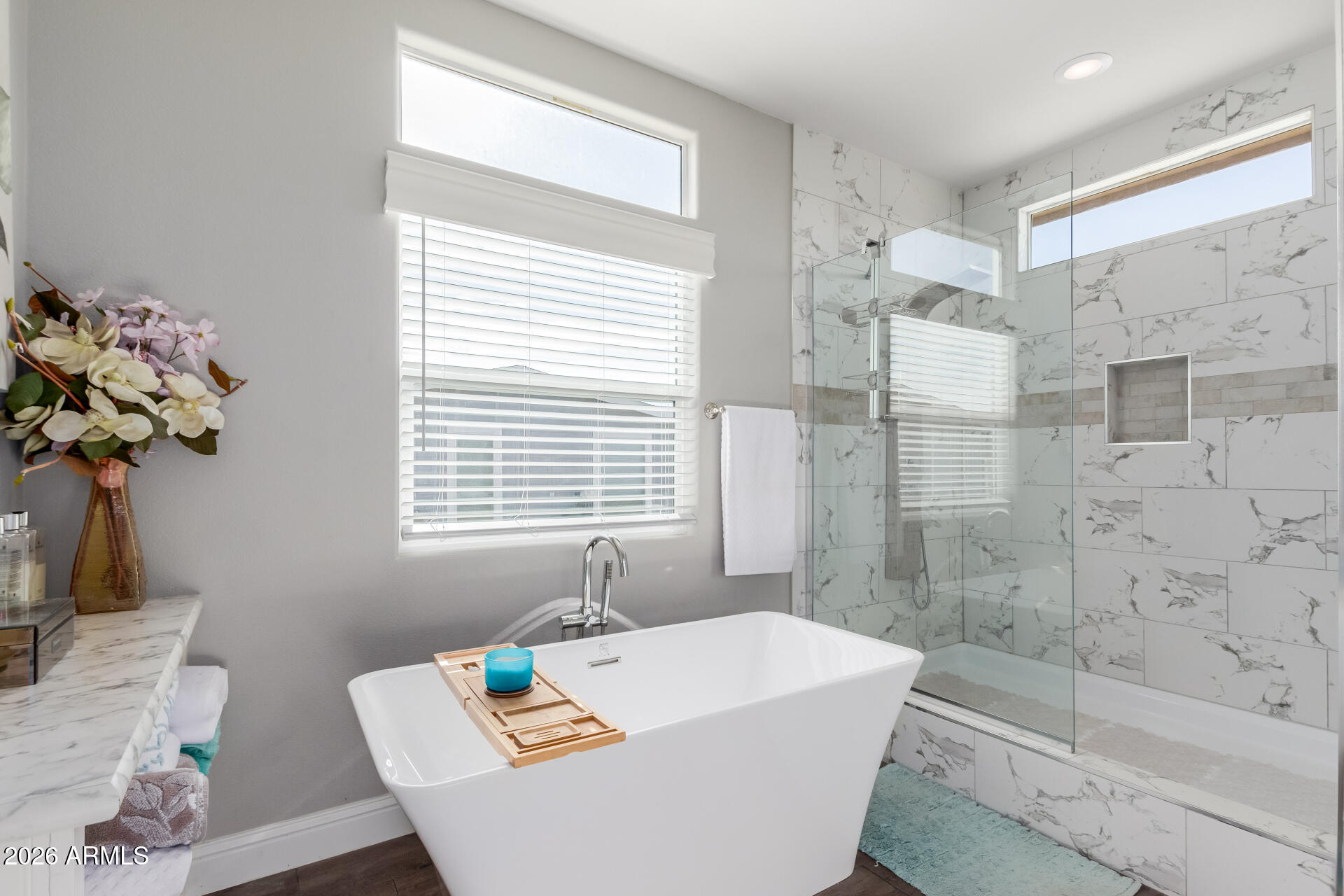 3301 South Goldfield Road, Unit 6031 Apache Junction, AZ 85119 - Photo 9 of 34 a bath tub sitting in a bathroom next to a window