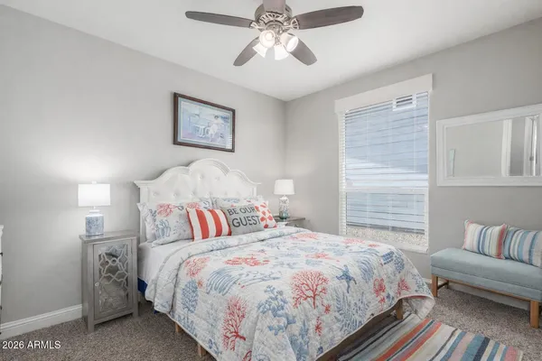 a bedroom with bed and a couch