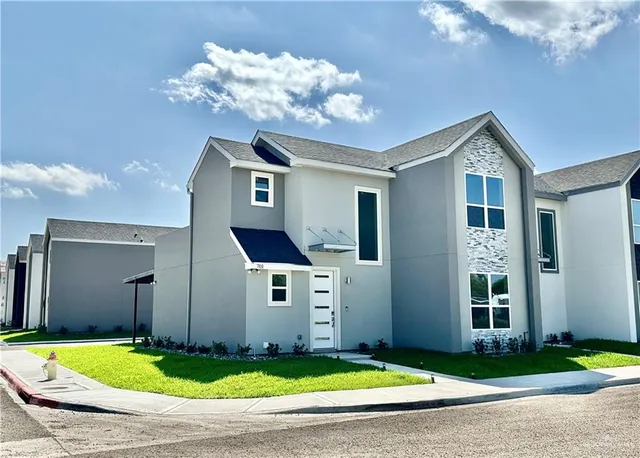 a front view of a house with yard