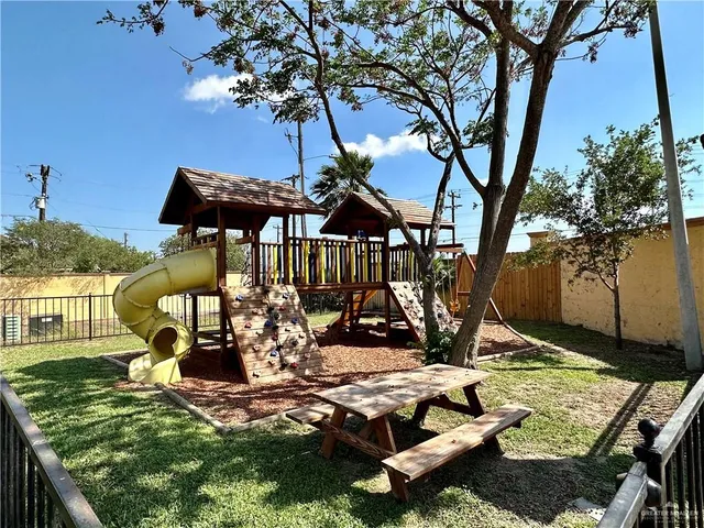 a view of a porch with chairs and potted plants