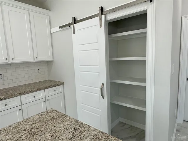 a kitchen with a cabinets and a stove