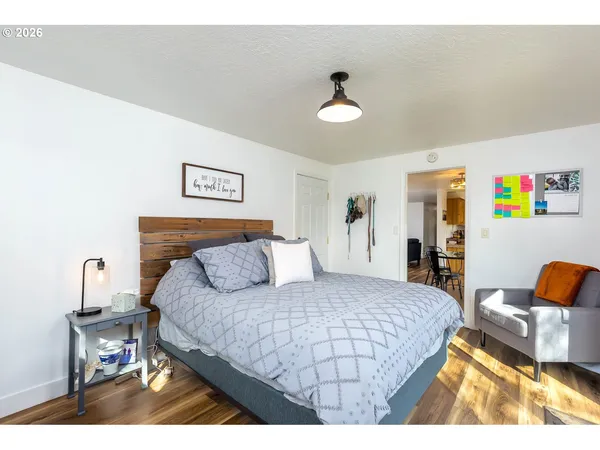 a bedroom with a bed and a couch