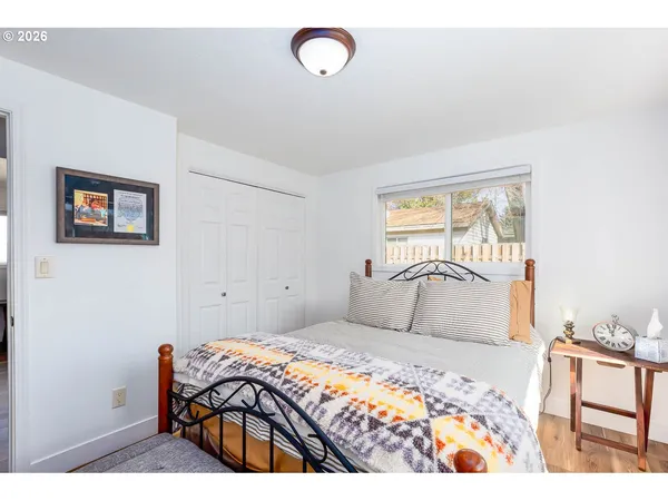 a bedroom with a bed and a table in it
