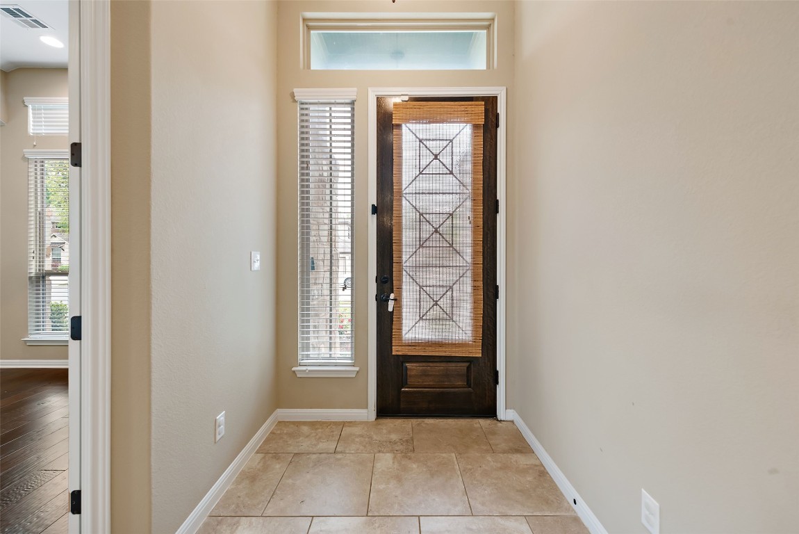 2000 Manada Trail Leander, TX 78641 - Photo 5 of 36 Enter into a welcoming foyer, featuring durable tile flooring and natural light.