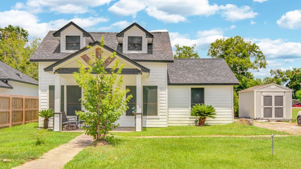 1256 2nd Street Clute, TX 77531 - Photo 2 of 43 a front view of a house with a yard