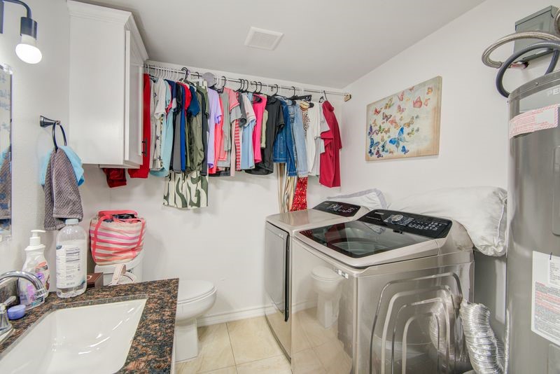 1256 2nd Street Clute, TX 77531 - Photo 24 of 43 a bathroom with a sink toilet and shower