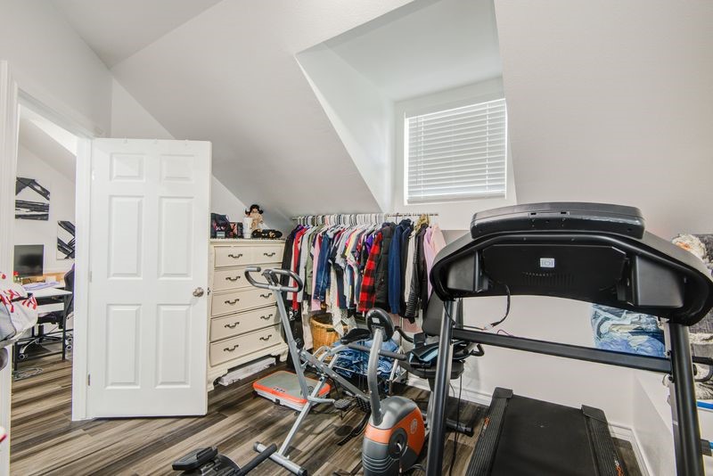 1256 2nd Street Clute, TX 77531 - Photo 29 of 43 a view of walk in closet with clothes and shoes