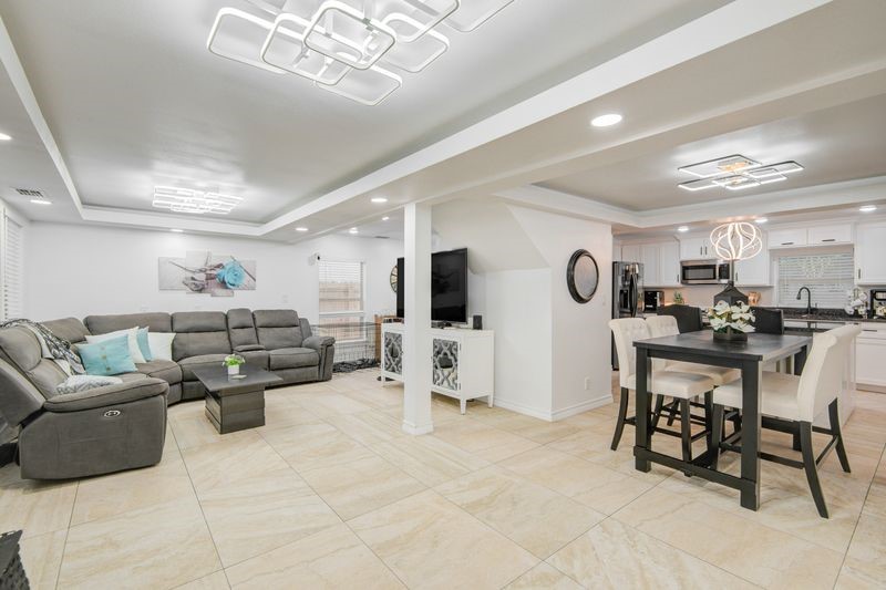 1256 2nd Street Clute, TX 77531 - Photo 7 of 43 a living room with furniture and a flat screen tv