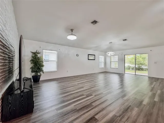 a view of a livingroom with wooden floor