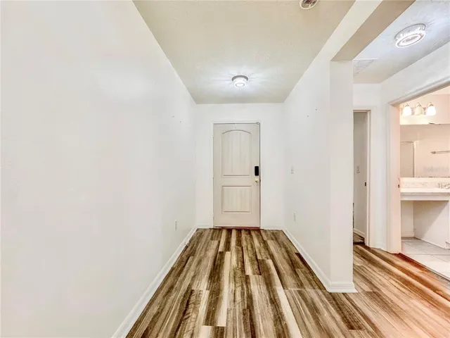 a view of a bedroom with wooden floor and bedroom