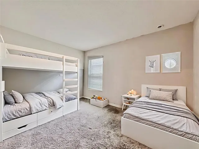 a view of a porch with chairs and backyard