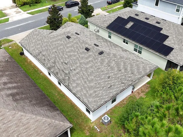 a front view of a house with swimming pool having outdoor seating