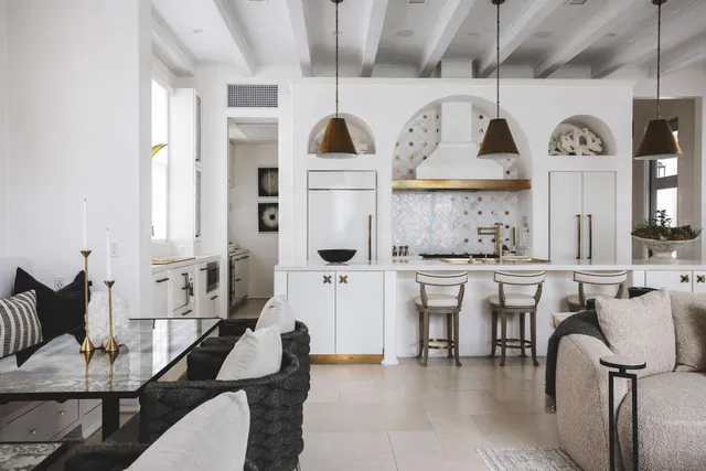 a living room with stainless steel appliances kitchen island granite countertop furniture and a kitchen view