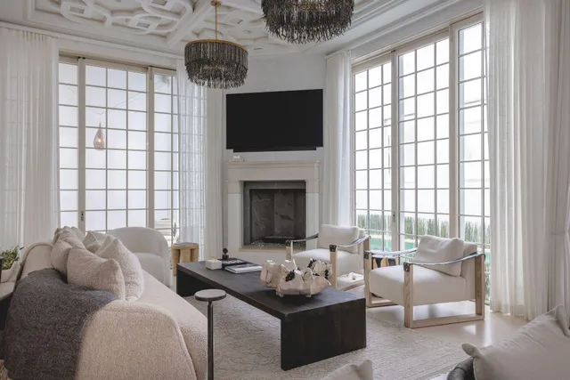 a living room with furniture fireplace and flat screen tv