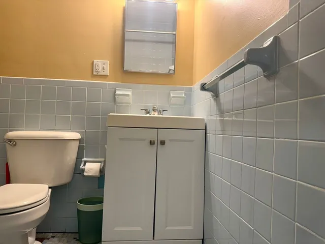 a bathroom with a toilet and a sink