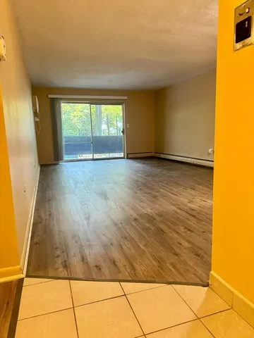 a view of an empty room and window