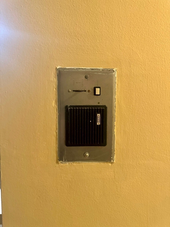 32 Whites Avenue, Unit E112 Watertown, MA 02472 - Photo 31 of 41 a building with a sign in front of it