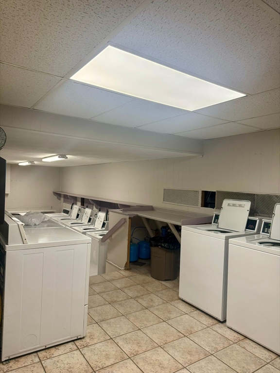 32 Whites Avenue, Unit E112 Watertown, MA 02472 - Photo 40 of 41 a utility room with dryer and washer