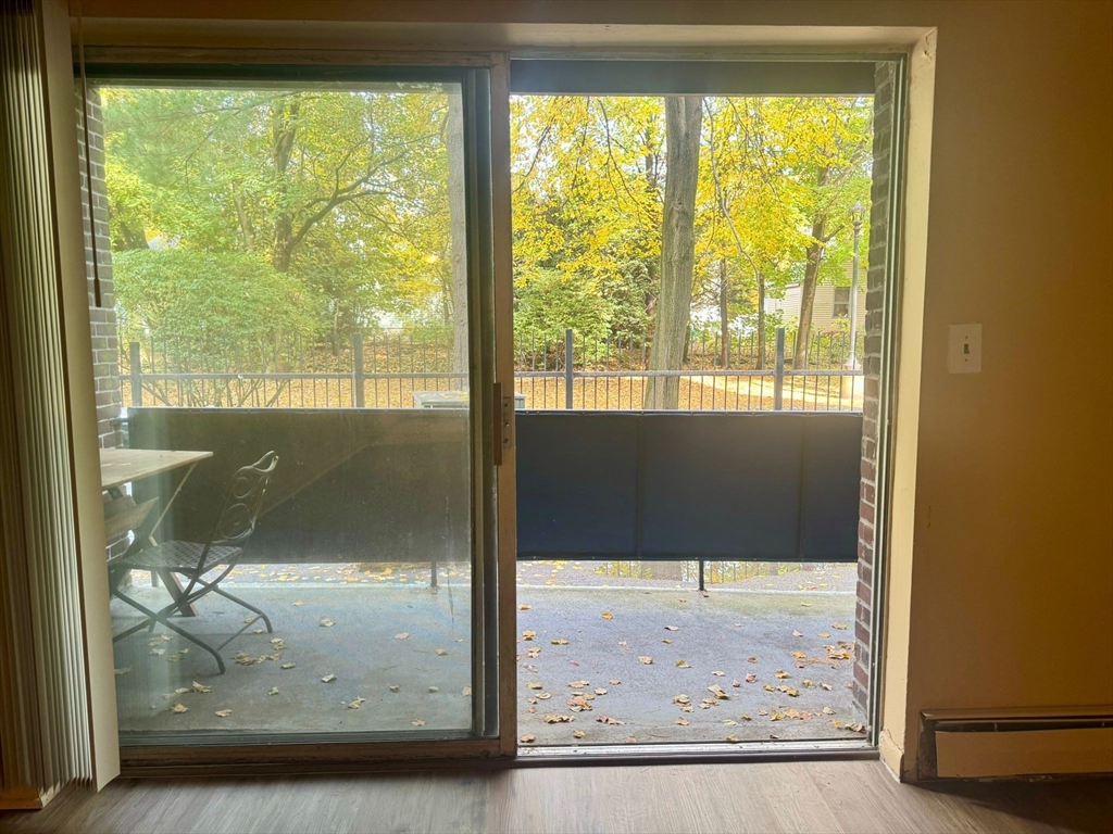 32 Whites Avenue, Unit E112 Watertown, MA 02472 - Photo 6 of 41 a view of an empty room and window