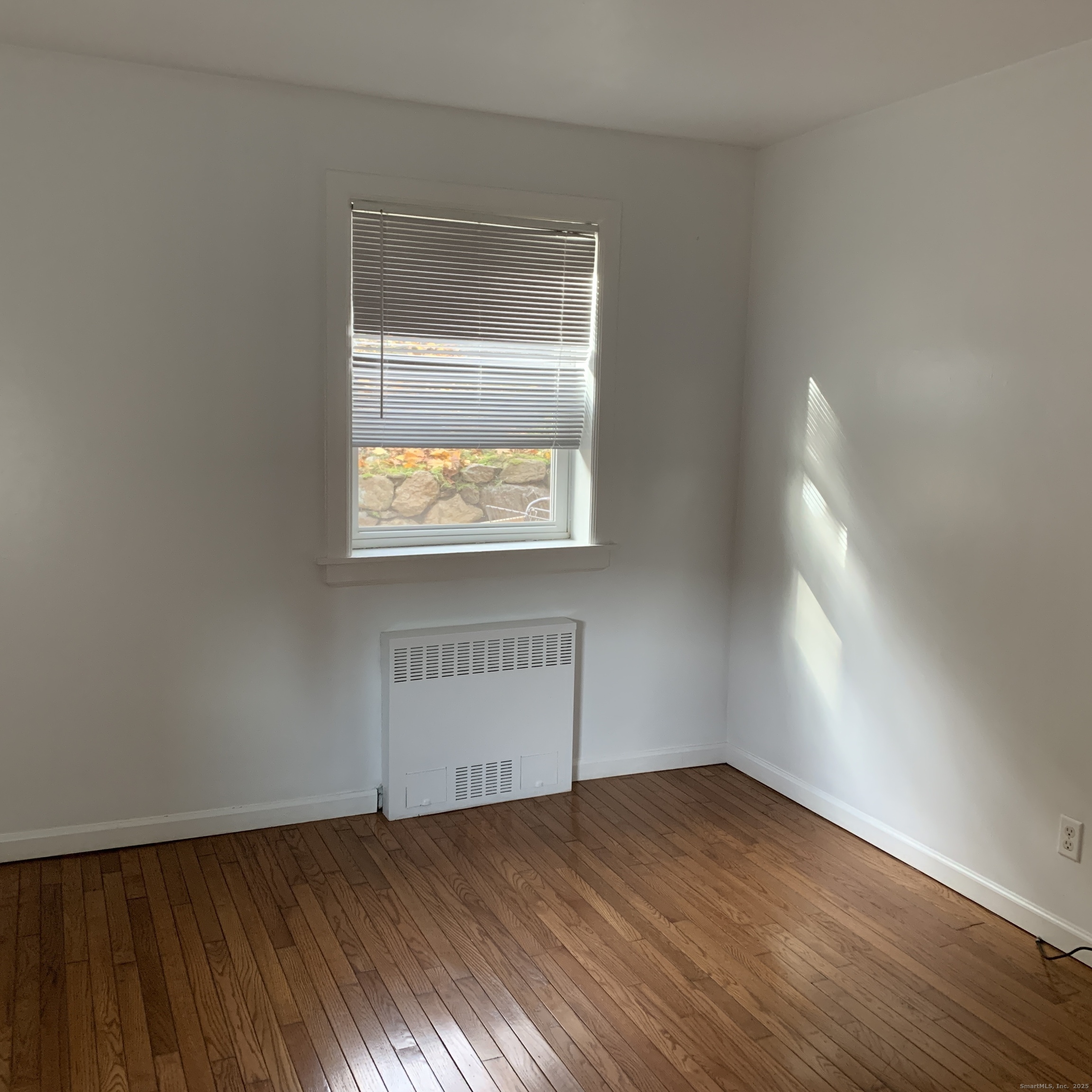 11 Bedford Avenue, Unit J1 Norwalk, CT 06850 - Photo 7 of 10 an empty room with a window