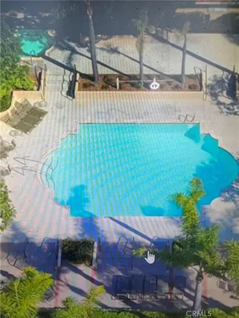 a view of a backyard with plants and outdoor seating