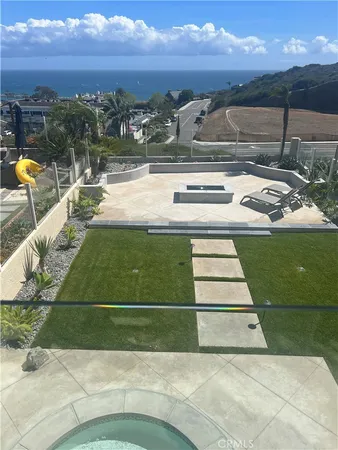 a view of a swimming pool with an outdoor seating