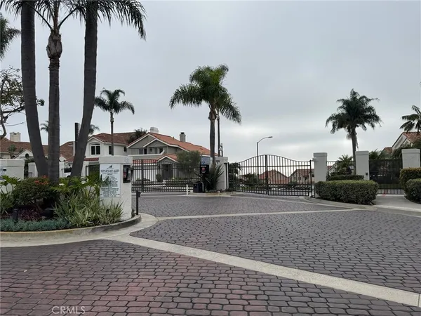 a view of multiple houses with a street