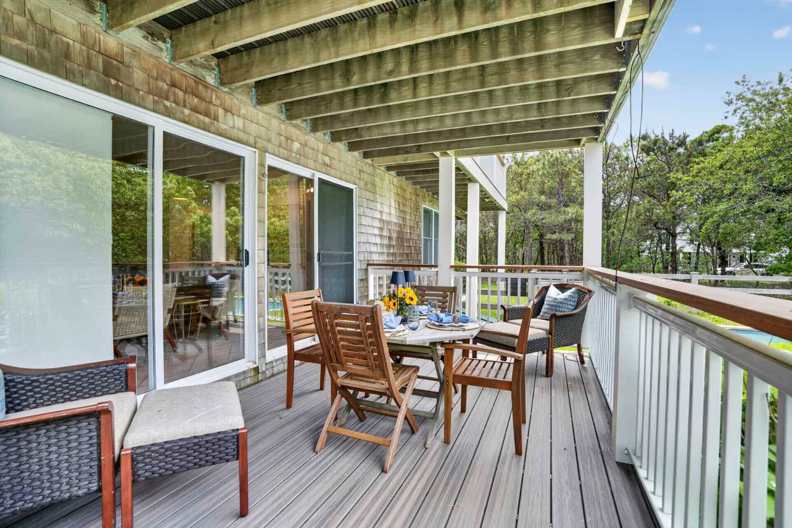 9 Thaxter Lane Edgartown, MA 02539 - Photo 47 of 53 a view of a roof deck with table and chairs and wooden floor