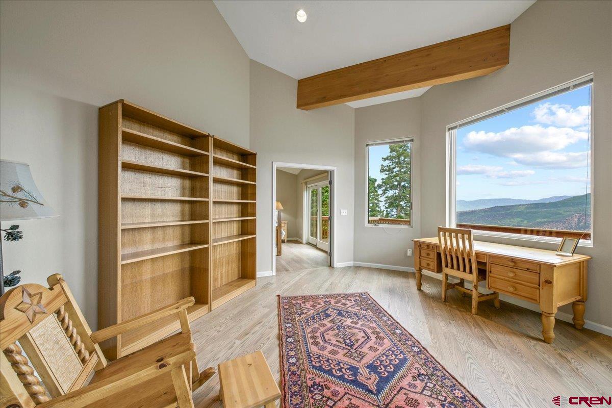 1600 Elk Ridge Trail Ridgway, CO 81432 - Photo 15 of 43 a bedroom with furniture and a window