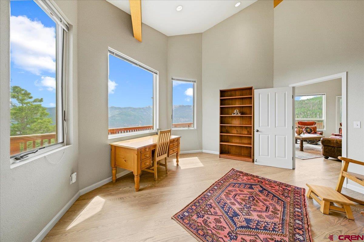 1600 Elk Ridge Trail Ridgway, CO 81432 - Photo 16 of 43 a living room with furniture a rug and a window