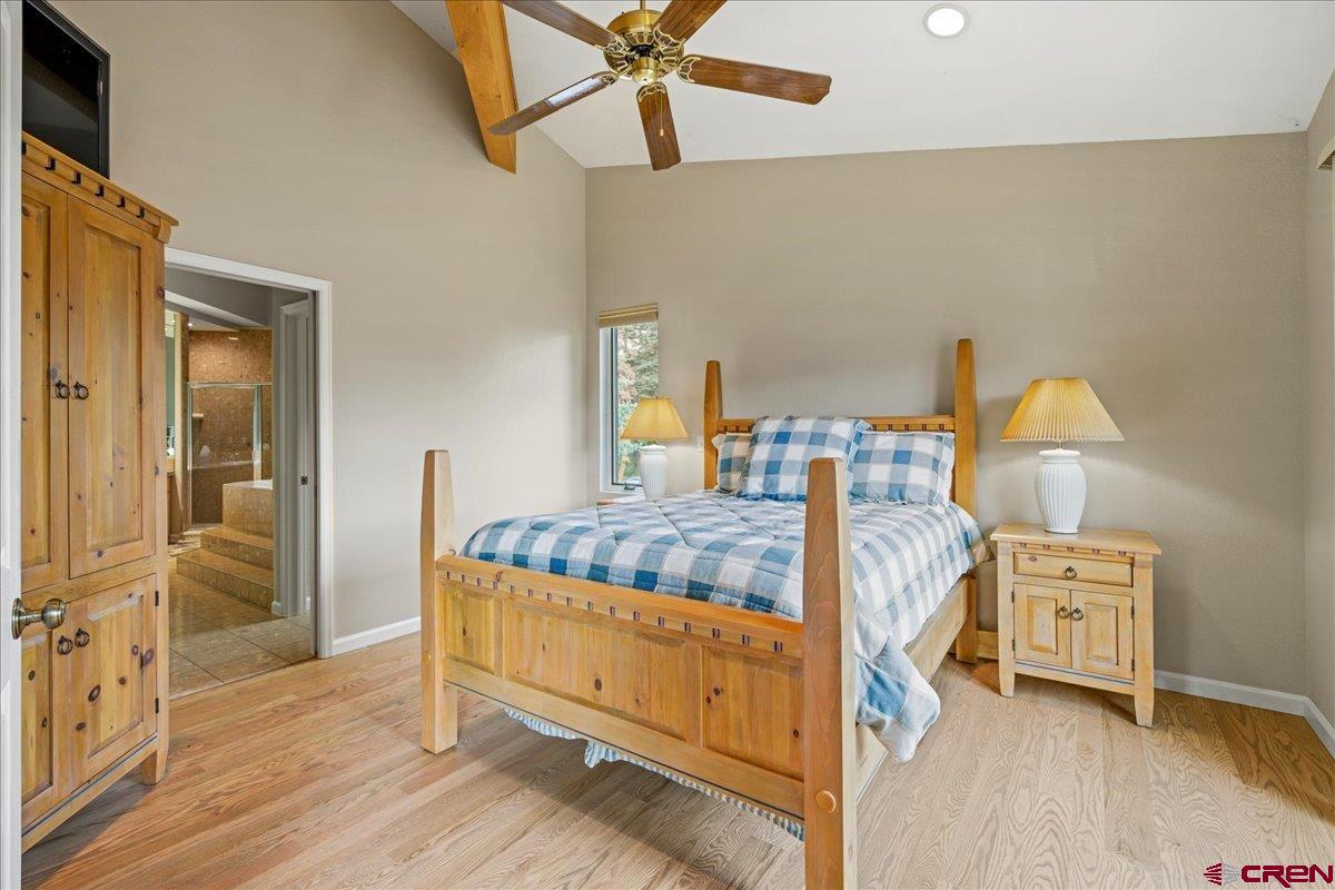 1600 Elk Ridge Trail Ridgway, CO 81432 - Photo 17 of 43 a bedroom with a bed and a table