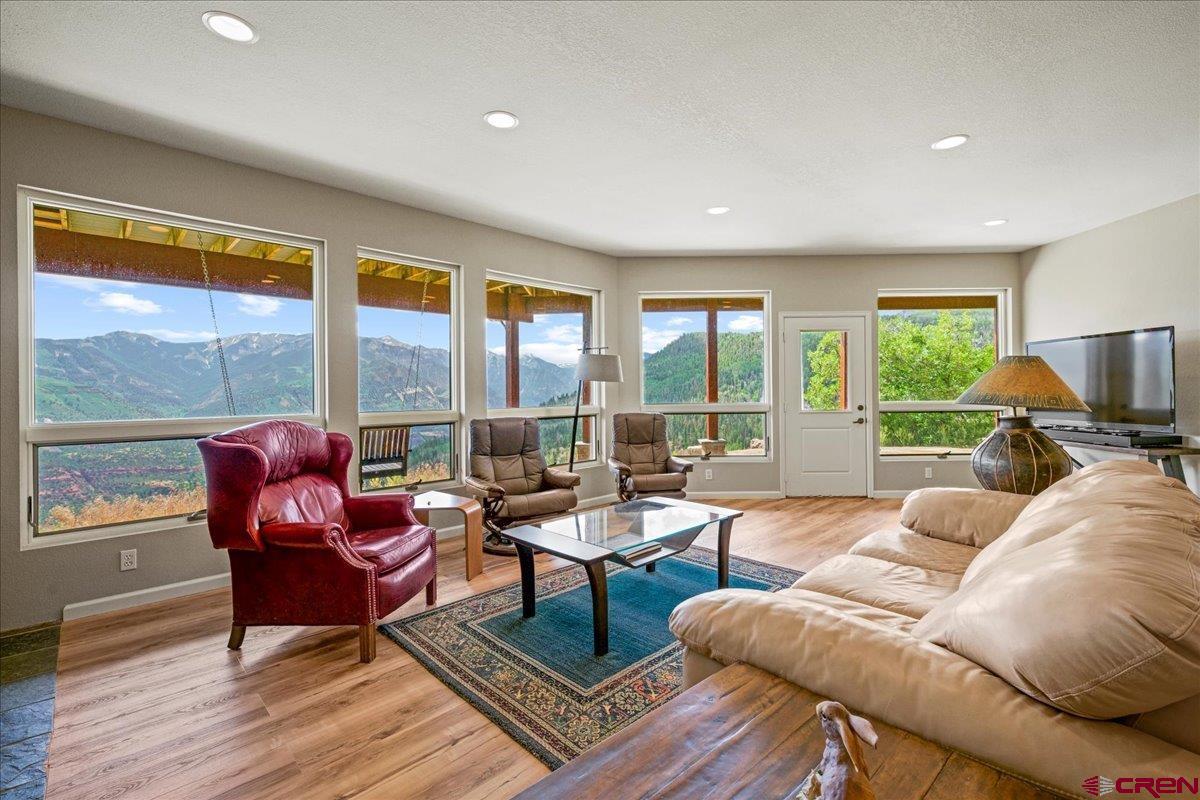 1600 Elk Ridge Trail Ridgway, CO 81432 - Photo 25 of 43 a living room with furniture and a large window