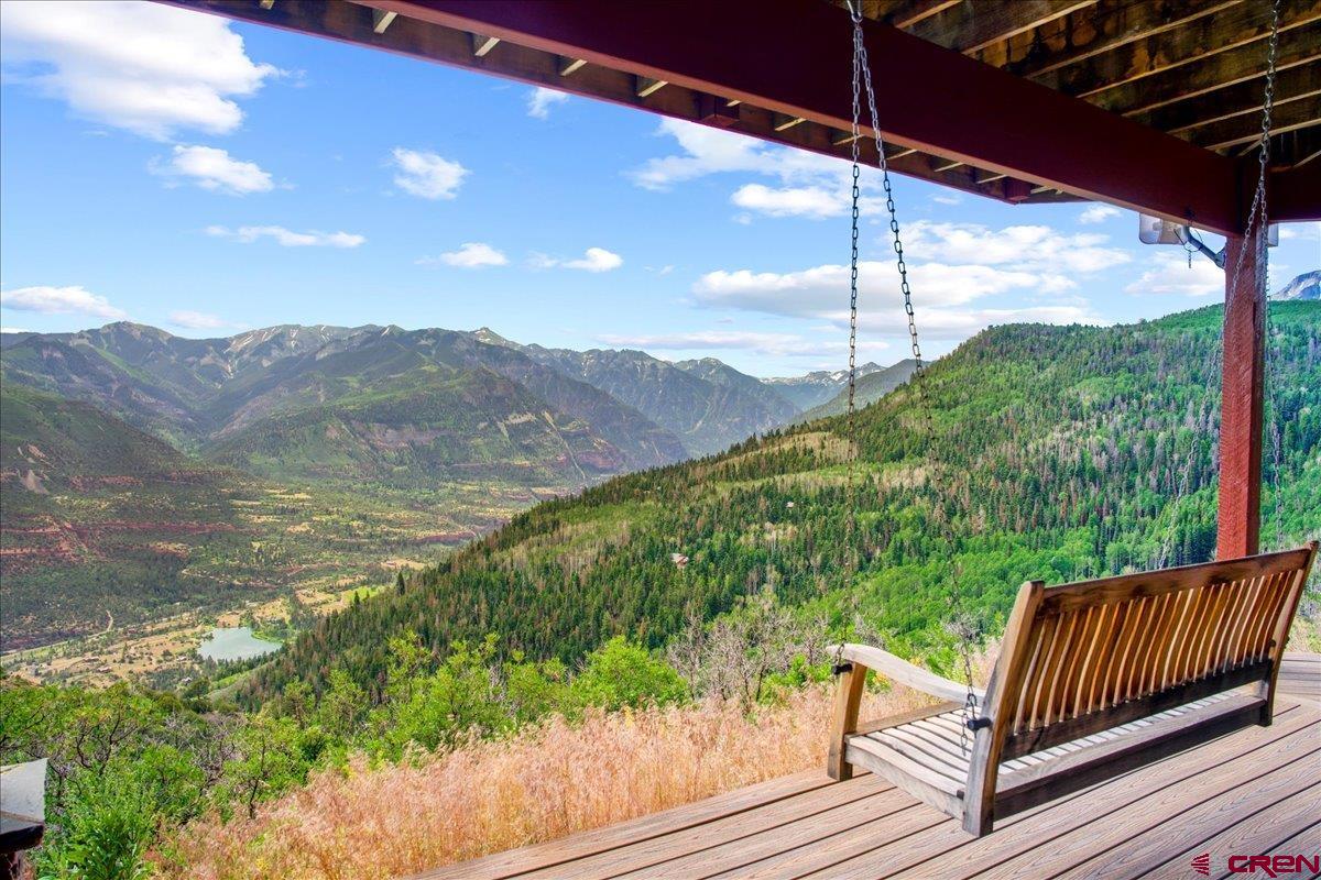 1600 Elk Ridge Trail Ridgway, CO 81432 - Photo 26 of 43 a view of a wooden deck with a yard