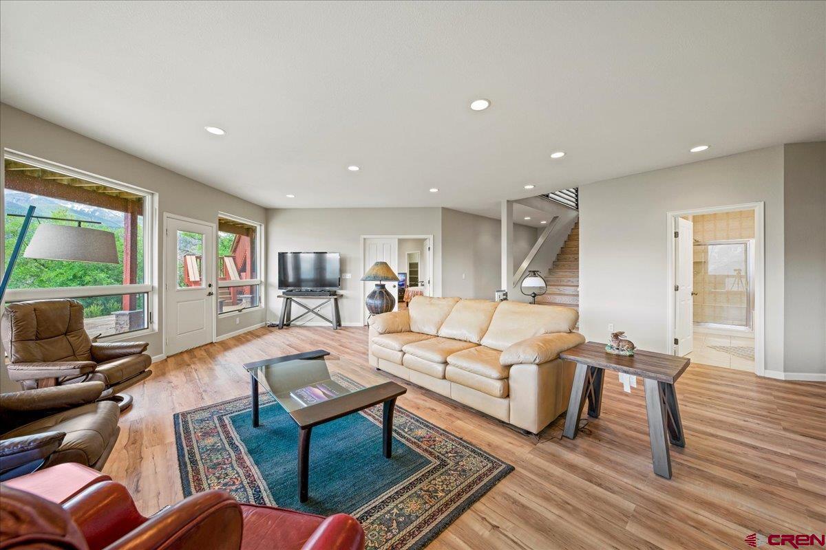 1600 Elk Ridge Trail Ridgway, CO 81432 - Photo 29 of 43 a living room with furniture or wooden floor and a large window