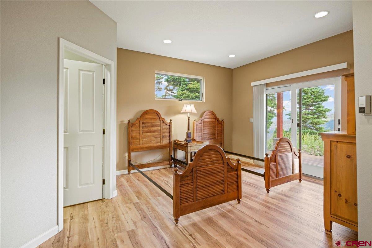 1600 Elk Ridge Trail Ridgway, CO 81432 - Photo 32 of 43 a view of a livingroom with furniture wooden floor and windows