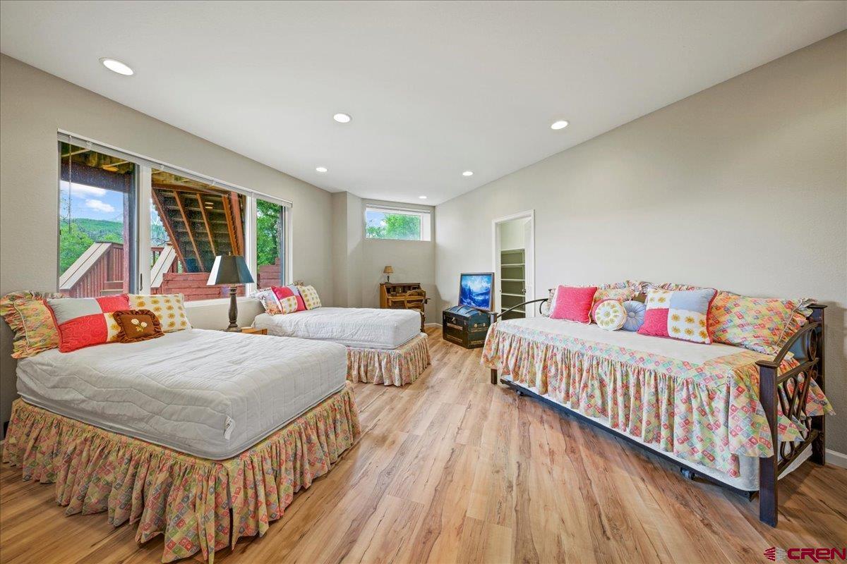 1600 Elk Ridge Trail Ridgway, CO 81432 - Photo 35 of 43 a bed room with two beds and a large window