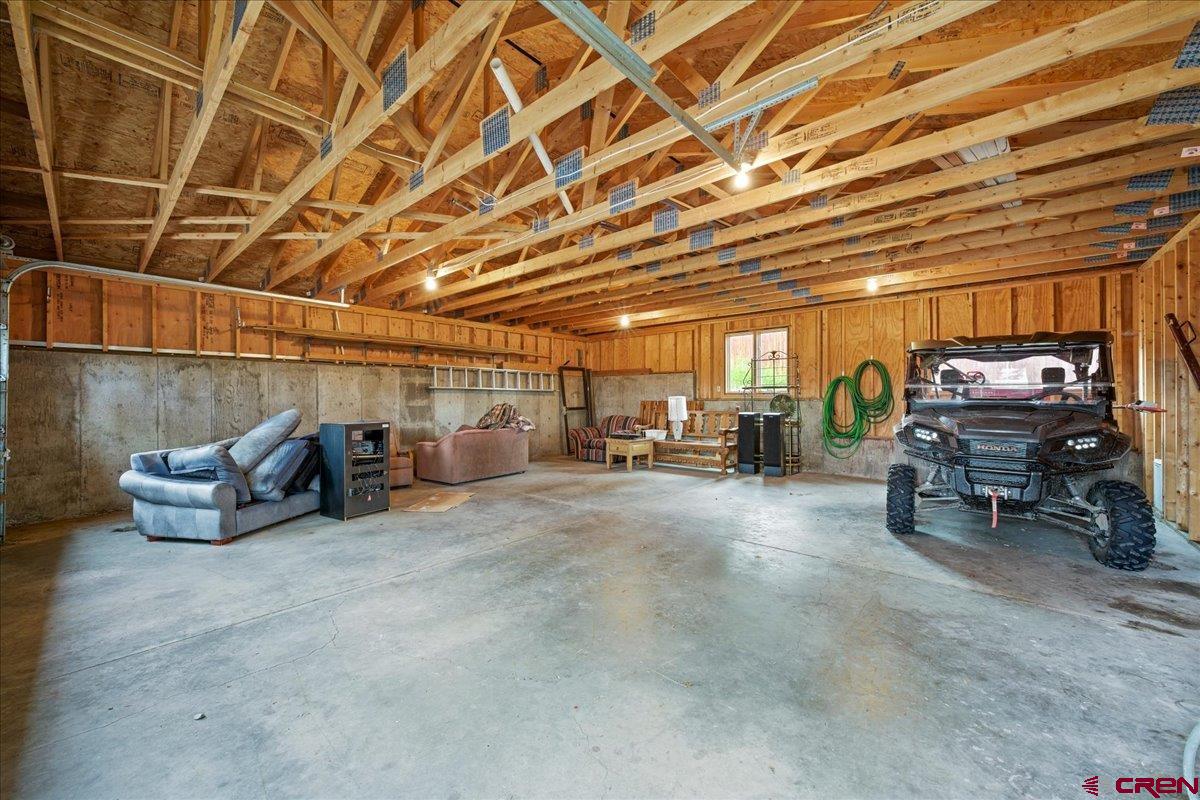 1600 Elk Ridge Trail Ridgway, CO 81432 - Photo 39 of 43 a view of parking garage with cars