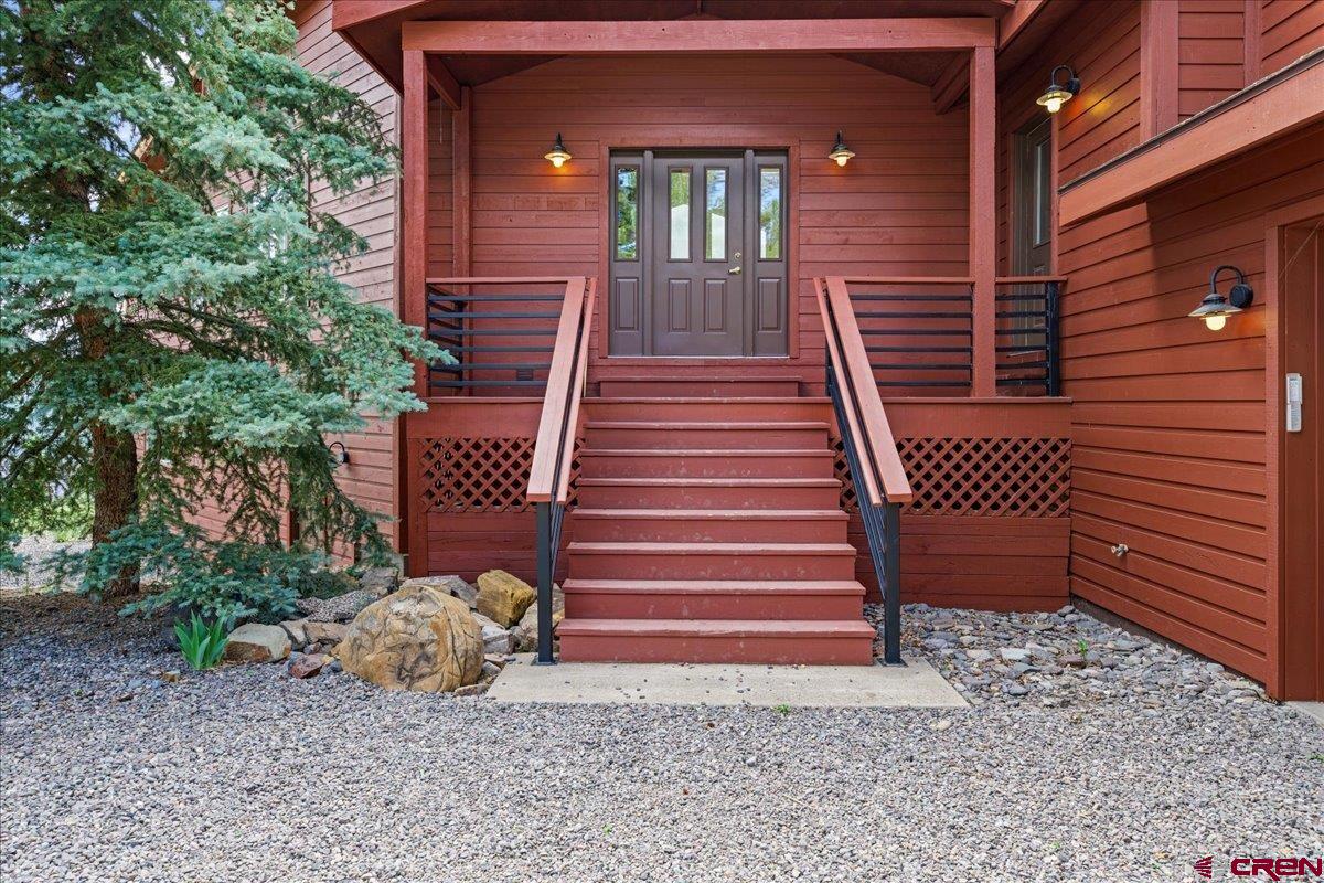 1600 Elk Ridge Trail Ridgway, CO 81432 - Photo 4 of 43 a view of a entrance with stairs and wooden floor