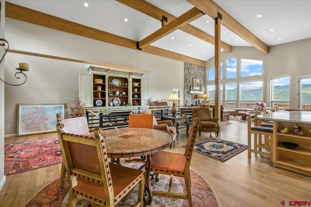 1600 Elk Ridge Trail Ridgway, CO 81432 - Photo 6 of 43 a view of a dining room with furniture window and wooden floor
