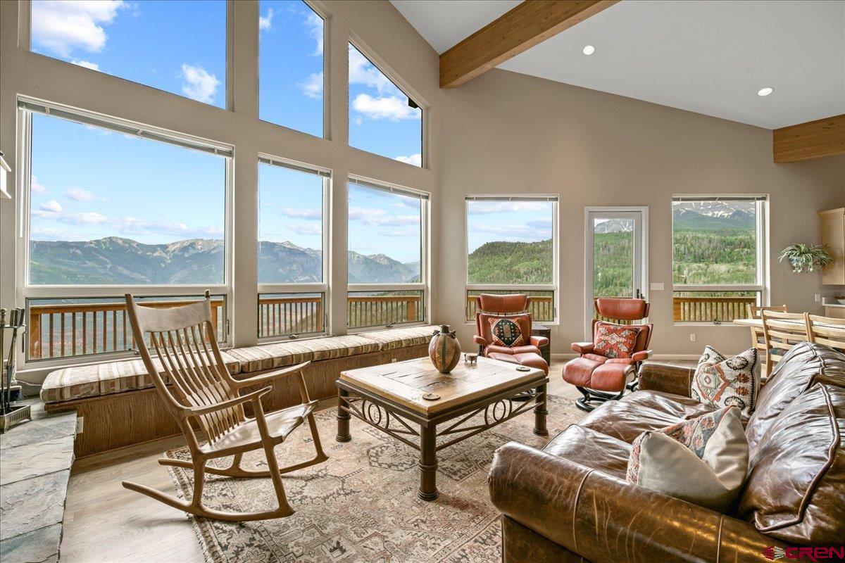 1600 Elk Ridge Trail Ridgway, CO 81432 - Photo 8 of 43 a living room with furniture and floor to ceiling windows