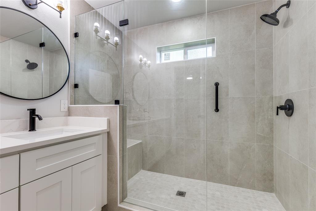 14234 Queens Chapel Road Farmers Branch, TX 75234 - Photo 15 of 21 a bathroom with a sink a toilet and shower